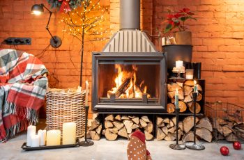 Couple in Christmas socks by the fireplace at home. The concept of comfort during winter and New Year holidays