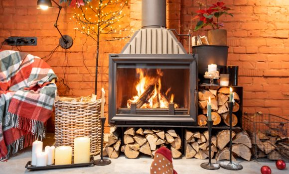 Couple in Christmas socks by the fireplace at home. The concept of comfort during winter and New Year holidays